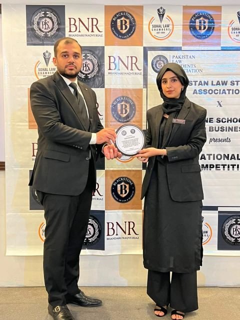 Farrokh Mushtaq adjudicating and presenting an award at a national moot court competition
